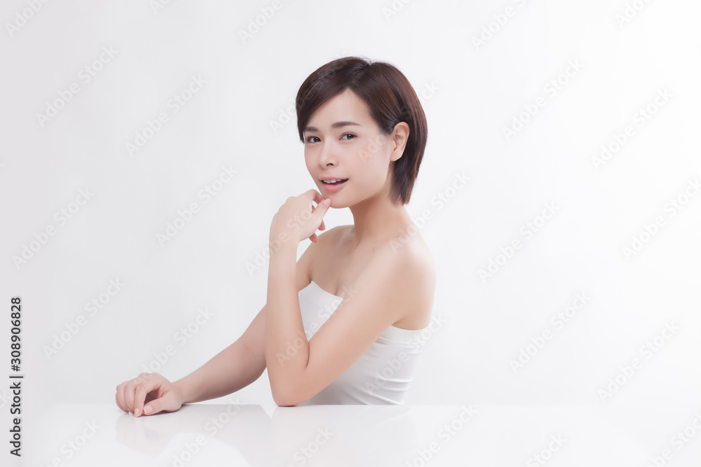Young beautiful Asian female model on the white background Young beautiful Asian female model on the white background