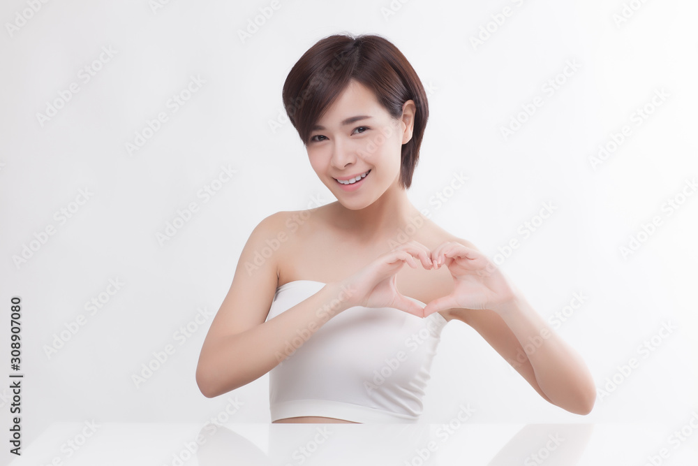 Young beautiful Asian female model on the white background Young beautiful Asian female model on the white background