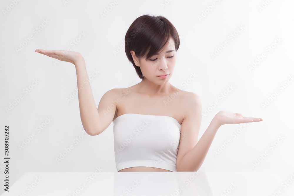 Young beautiful Asian female model on the white background Young beautiful Asian female model on the white background