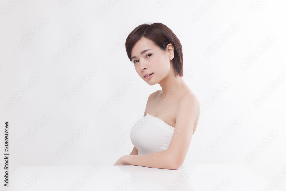 Young beautiful Asian female model on the white background Young beautiful Asian female model on the white background
