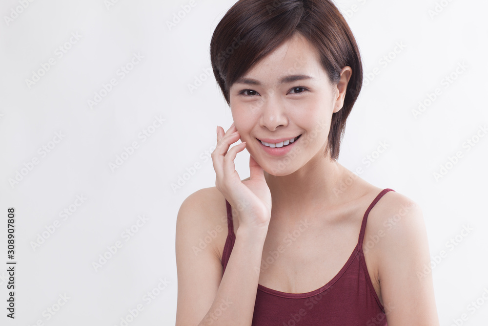 Young beautiful Asian female model on the white background Young beautiful Asian female model on the white background