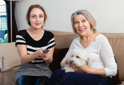 Two women watching TV photo