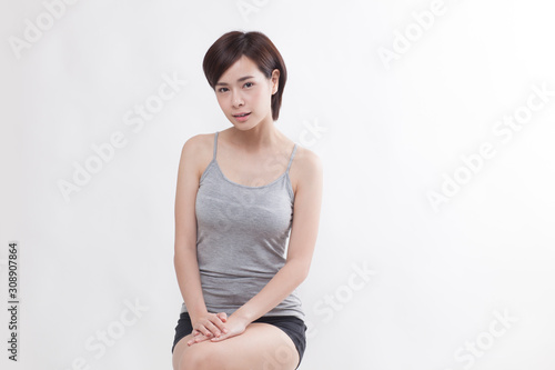 Young beautiful Asian female model on the white background