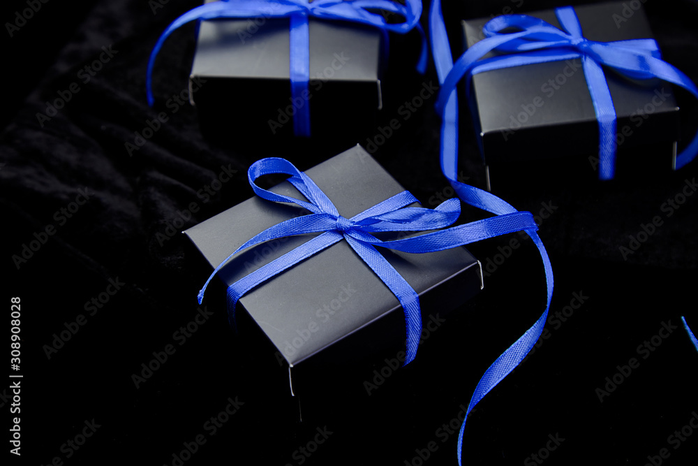 Luxury black gift boxes with blue ribbon on shine black background.  Christmas, birthday party presents. Father Day. Flat lay. Copy space. Top  view. Stock Photo | Adobe Stock