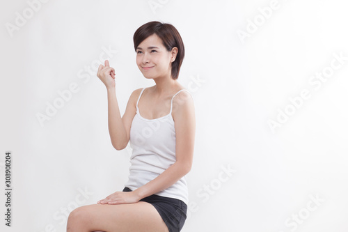 Young beautiful Asian short hair female model on white background