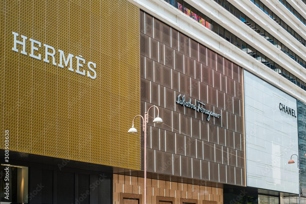 Luxury brand stores of Hermes, Chanel and salvatore ferragamo at shoppind  district in Hongkong - November, 2019 Stock Photo | Adobe Stock