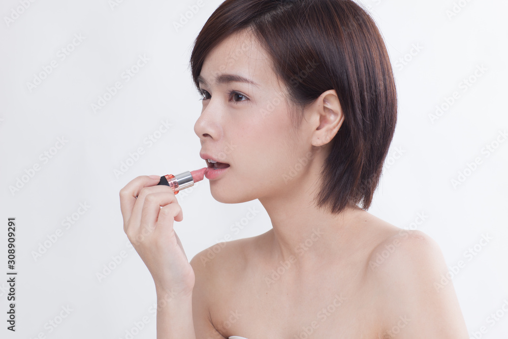 Young beautiful Asian short hair female model on white background Young beautiful Asian short hair female model on white background
