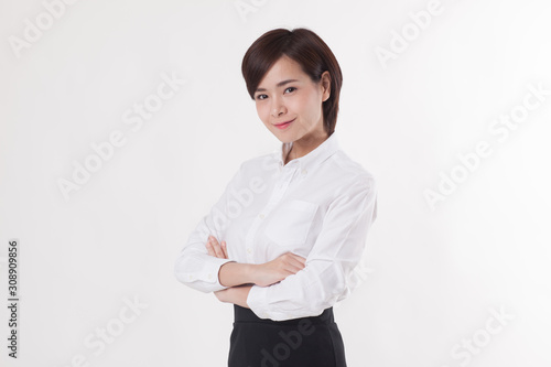 Young beautiful Asian female model on the white background for business concept