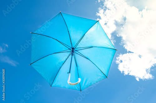 umbrella on background of blue sky.