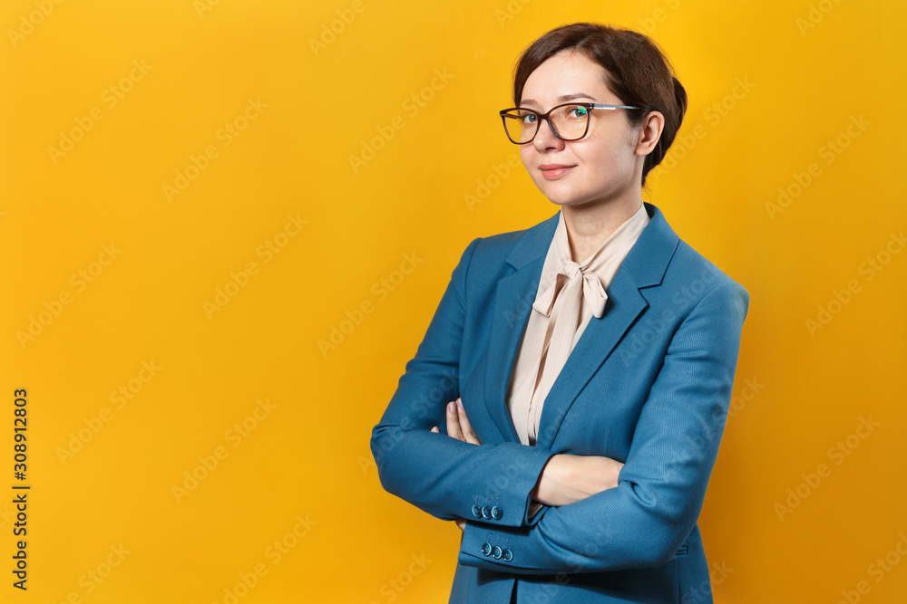 Smiling business woman in glasses on a yellow background Smiling business woman in glasses on a yellow background