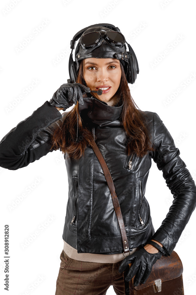 Beautiful girl in pilot costume with helmet headphones Beautiful girl in pilot costume with helmet headphones