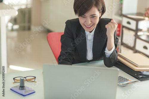 Young Asian short hair female model in formal dress which is good for business purpose