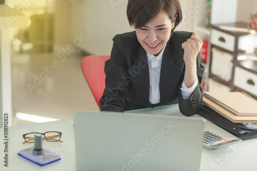 Young Asian short hair female model in formal dress which is good for business purpose