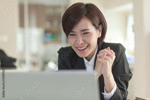 Young Asian short hair female model in formal dress which is good for business purpose
