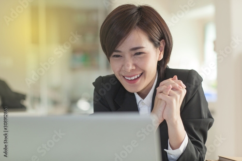 Young Asian short hair female model in formal dress which is good for business purpose