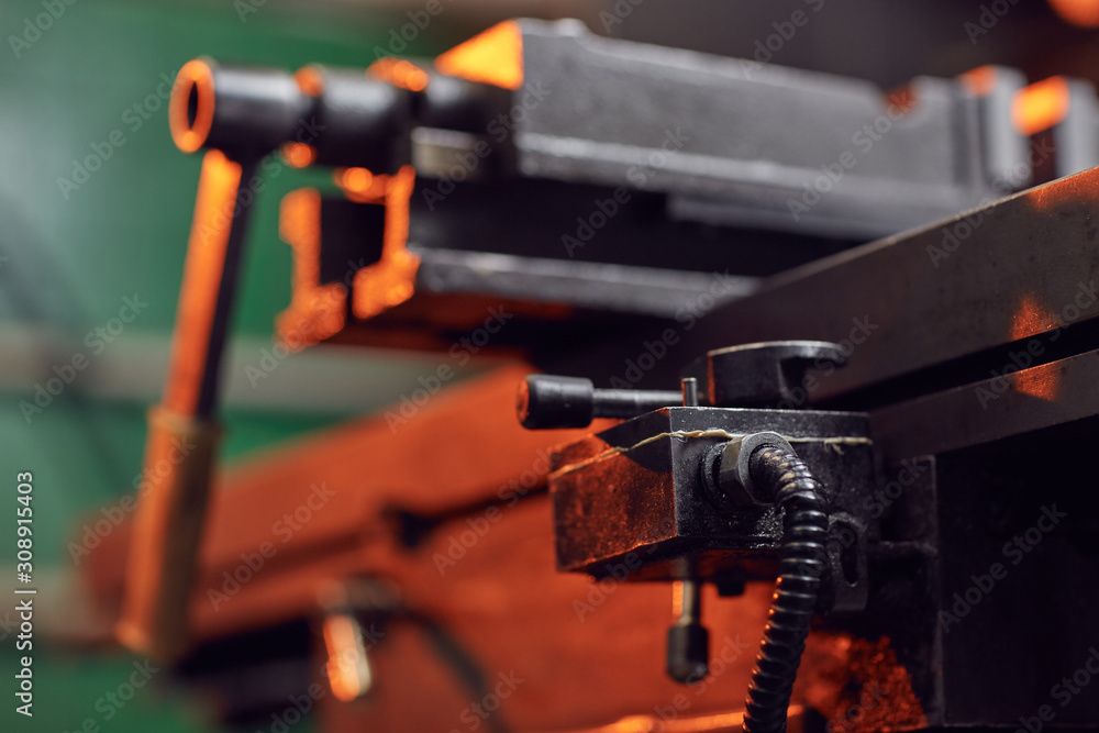 Close-up of metal lathe for metal work in the workshop Close-up of metal lathe for metal work in the workshop