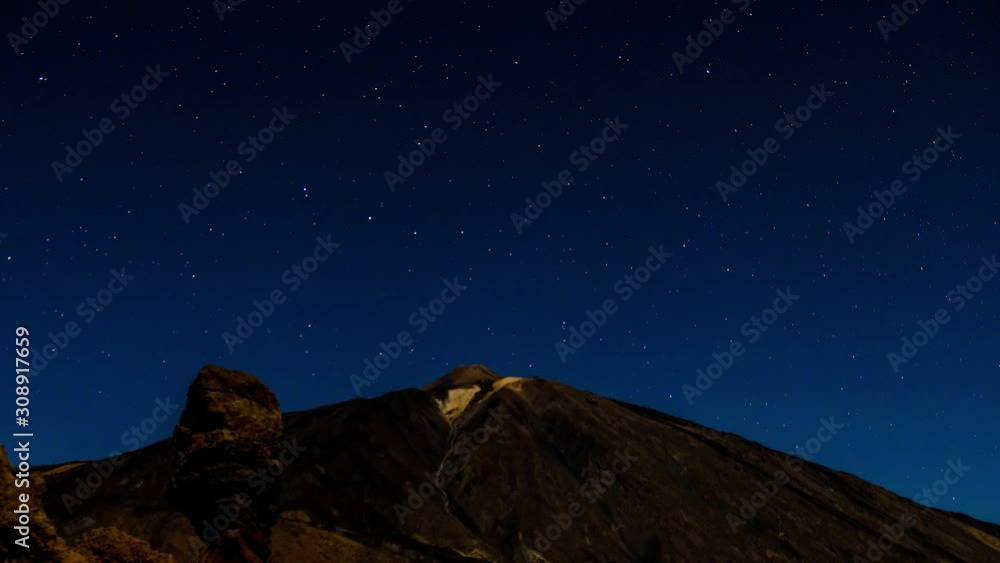 Time lapse of star trails moving over Teide volcano and Los Roques de Garcia rocks, Teide National Park, Tenerife, Canary islands, Spain. Time lapse of star trails moving over Teide volcano and Los Roques de Garcia rocks, Teide National Park, Tenerife, Canary islands, Spain.