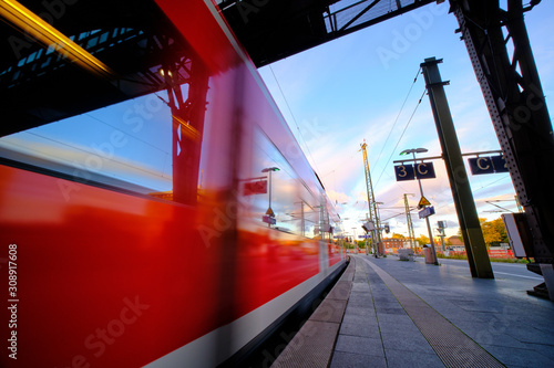 Train waggons, motion blurred, passing by at the train station