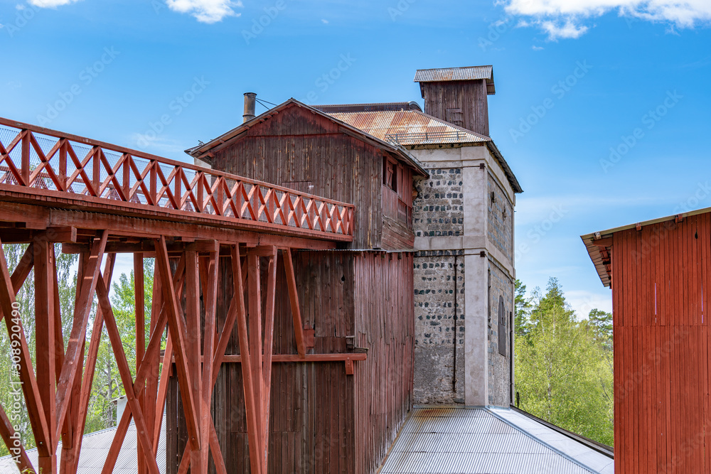 Old Swedish ironworks with access ramp in beautiful summer sunlight Old Swedish ironworks with access ramp in beautiful summer sunlight