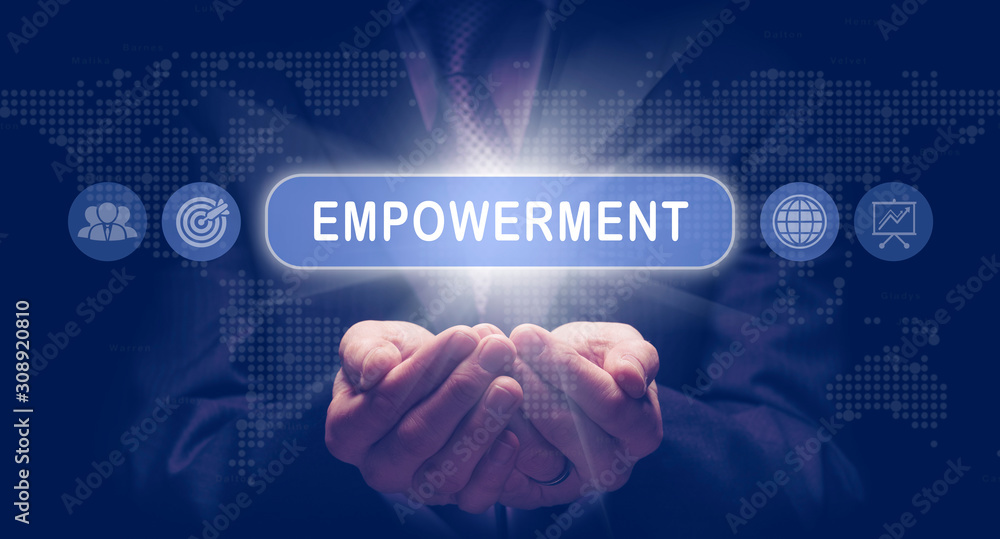 Businessmans cupped hands holding a Empowerment business concept on a computerised display. Businessmans cupped hands holding a Empowerment business concept on a computerised display.