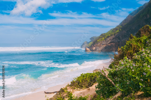 Beautiful beach with turquoise ocean in Bali. © artifirsov
