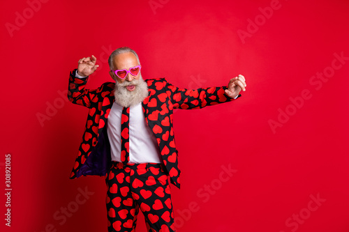 Portrait of his he nice attractive funky cool modern trendy gray-haired guy hipster MC dancing having fun isolated on bright vivid shine vibrant red color background photo