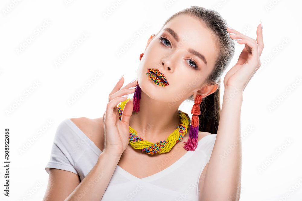 beautiful girl in beaded accessories, with beads on lips, looking at camera isolated on white beautiful girl in beaded accessories, with beads on lips, looking at camera isolated on white
