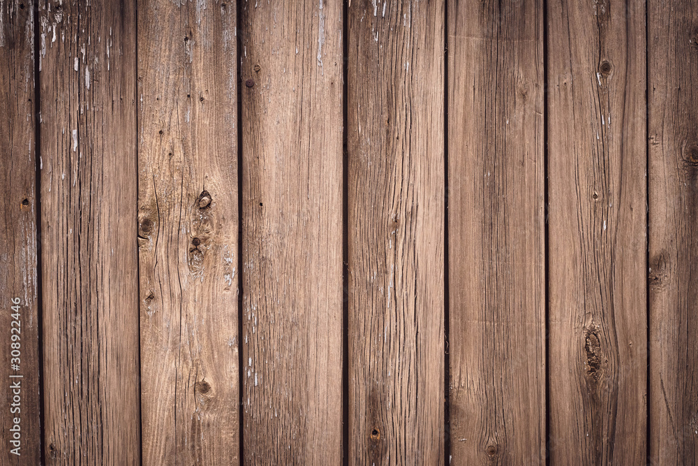 Fototapeta premium Texture of wooden boards of tree. Vintage wooden fence, desk surface. Natural color. Weathered timber, background. Rustic table of oak. Brown old wood planks.