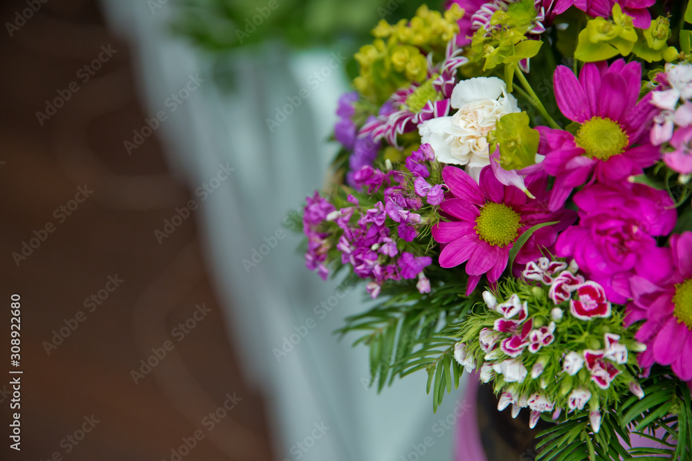 Beautiful wedding colorful purple bouquet for bride. Beauty of colored flowers. Flowers backgrounds . Beautiful bunch of purple flowers with white, red and yellow flowers .