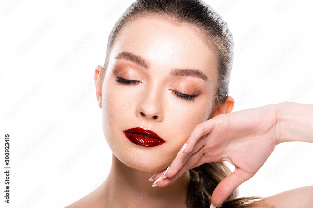 attractive young woman touching face with closed eyes isolated on white attractive young woman touching face with closed eyes isolated on white