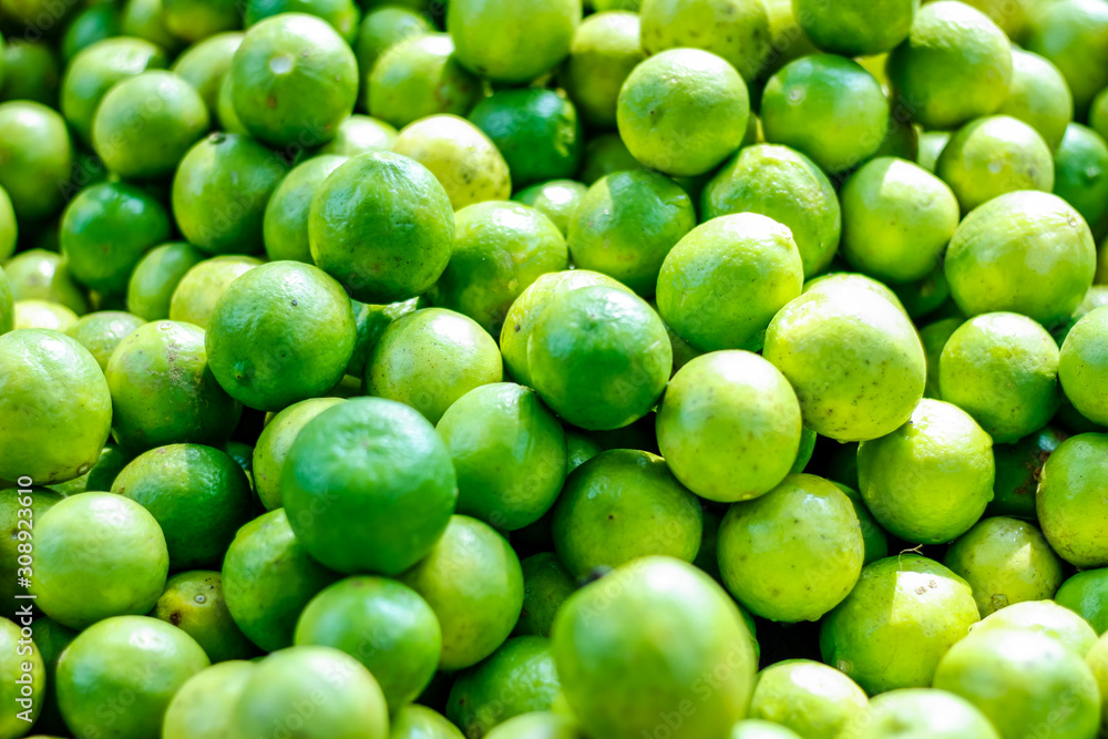 Green and yellow lemon in indian vegetable market Green and yellow lemon in indian vegetable market