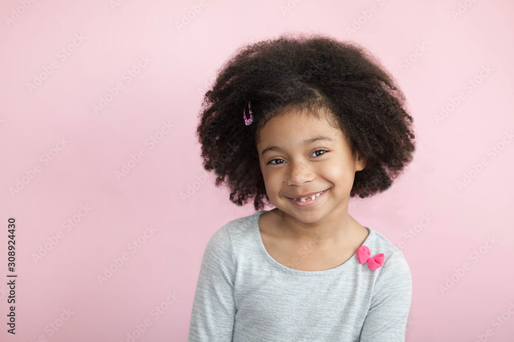 Happy adorable african american child girl isolated on pastel background. Laughing face. Real emotions. Happy adorable african american child girl isolated on pastel background. Laughing face. Real emotions.