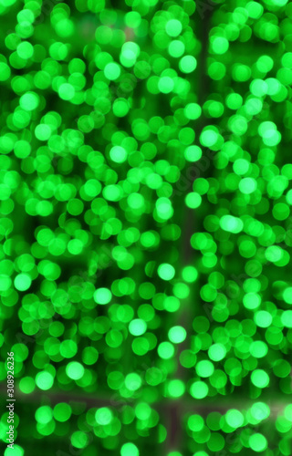 Vertical Image of Abstract Blurred Illuminated Green Lights