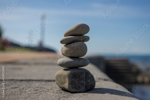 Canvas Print Five stones cairn tower, rock zen sculpture, brown beige pebbles