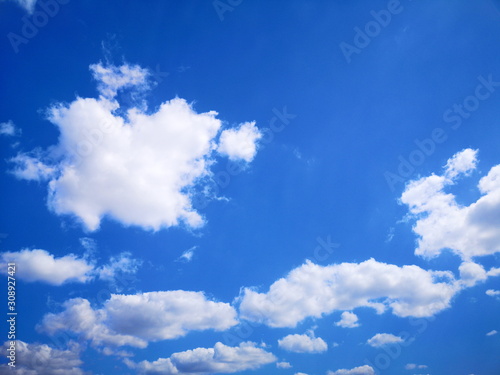 Beautiful blue sky and cloud background on sunshine day.