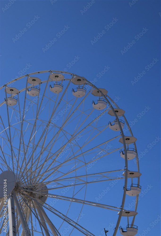 Ferris Wheel with blue sky background detail