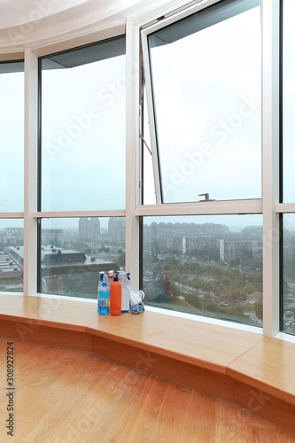 Washing windows inside modern interior