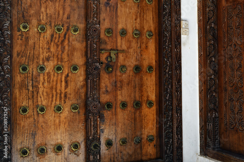 Traditional wooden carved door in Stone Town, Zanzibar, Tanzania, Africa