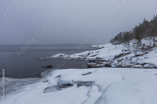 Blizzard on the rocky shore of Lake Ladoga