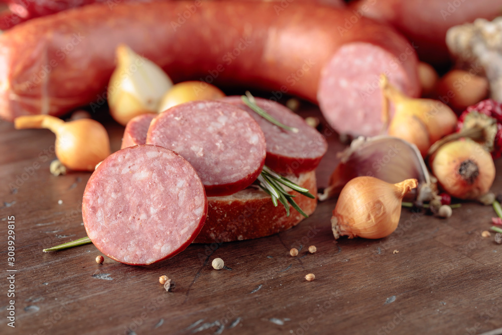 Sandwich with salami on a old wooden table. Sandwich with salami on a old wooden table.