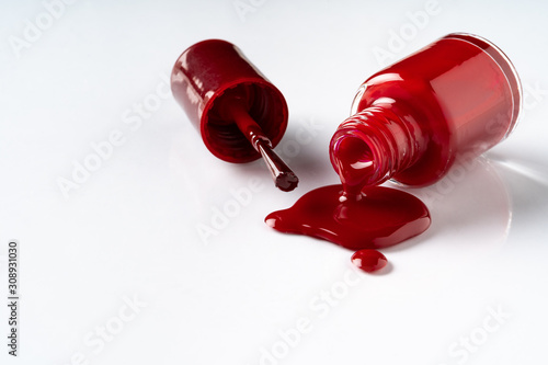 Puddle of spilled nail lacquer on a white background