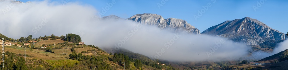 Large panorama of fog entering the valley