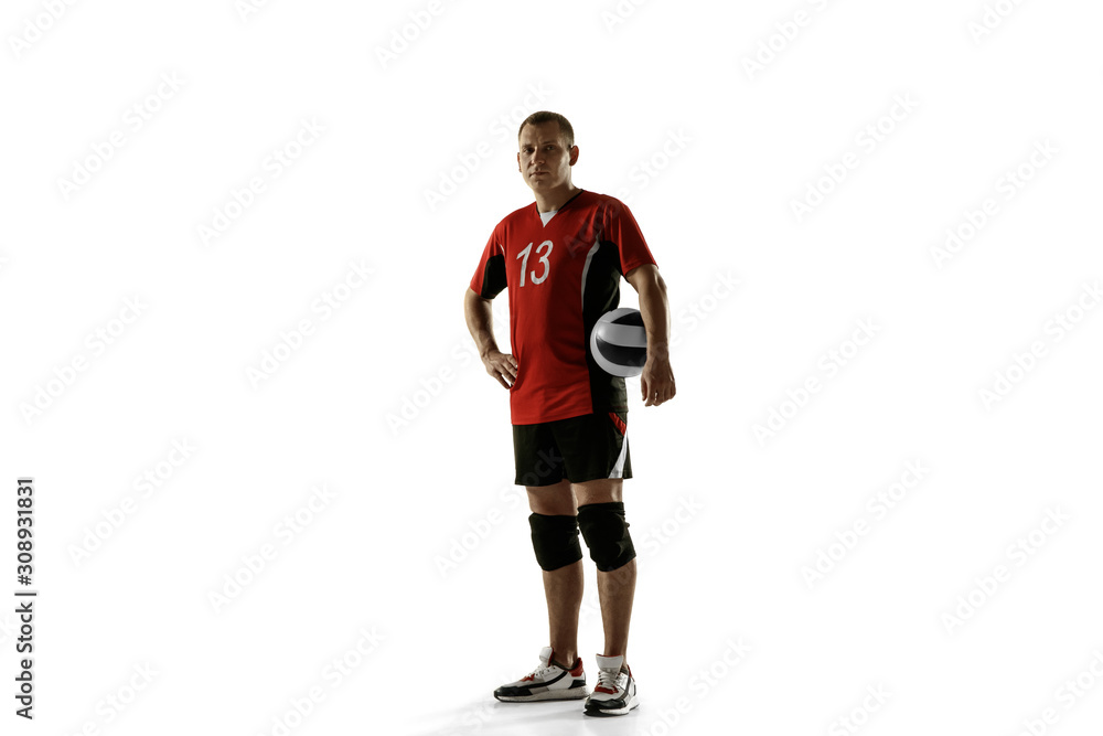 Young caucasian volleyball player placticing on white background. Male sportsman posing confident with the ball, prepared for win. Sport, healthy lifestyle, activity, movement concept. Copyspace.