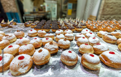 Chanukah donuts are full of hot and sweet jam. The Jewish holiday in the middle of the cold winter. Delicious and festive. enjoy your meal! photo