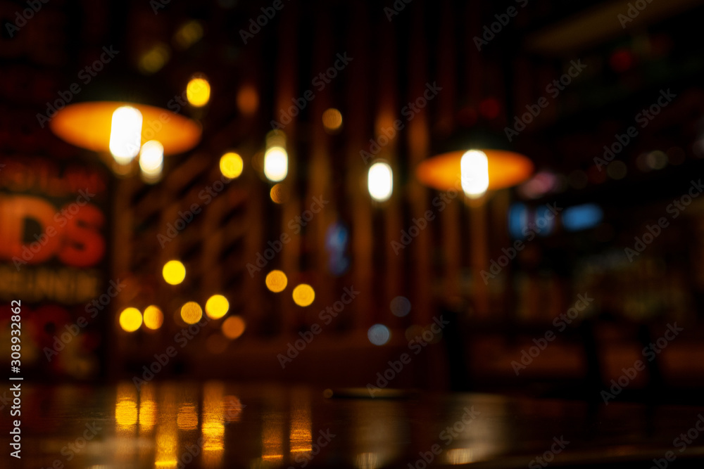 Blurred background in modern cafe, bokeh of lights.