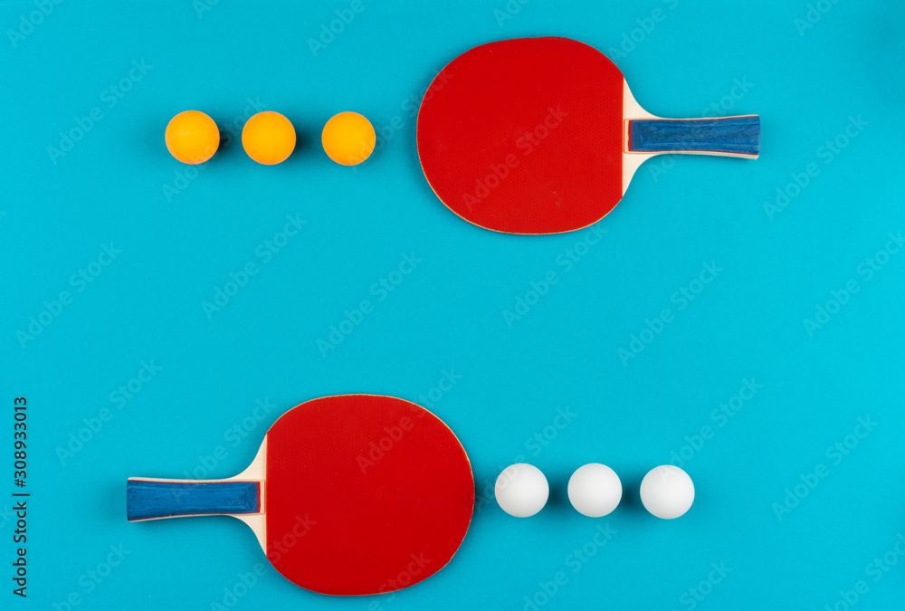Ping pong racket and ball on blue background Ping pong racket and ball on blue background
