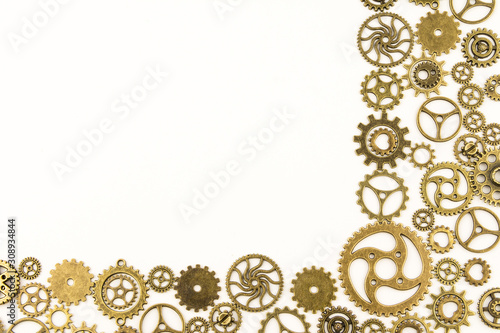 metallic gears background / Closeup of metal cog gears / close up texture pattern steampunk style and old mechanical peaces / decorative frame