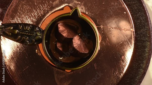 wax melt and stamp pour from wax, close up from above, soft focus