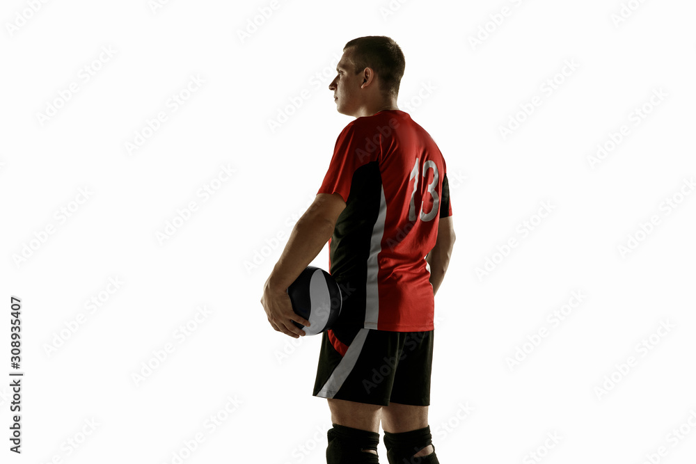 Young caucasian volleyball player placticing on white background. Male sportsman posing confident with the ball, prepared for win. Sport, healthy lifestyle, activity, movement concept. Copyspace. Young caucasian volleyball player placticing on white background. Male sportsman posing confident with the ball, prepared for win. Sport, healthy lifestyle, activity, movement concept. Copyspace.