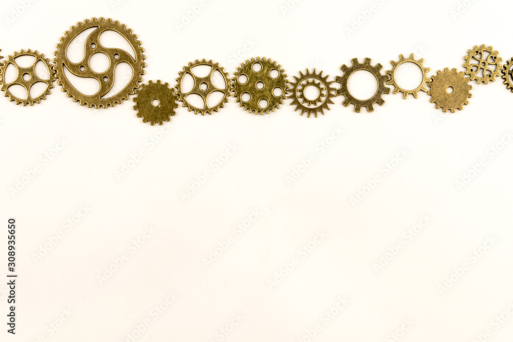 metallic gears background / Closeup of metal cog gears / close up texture pattern steampunk style and old mechanical peaces / decorative frame metallic gears background / Closeup of metal cog gears / close up texture pattern steampunk style and old mechanical peaces / decorative frame